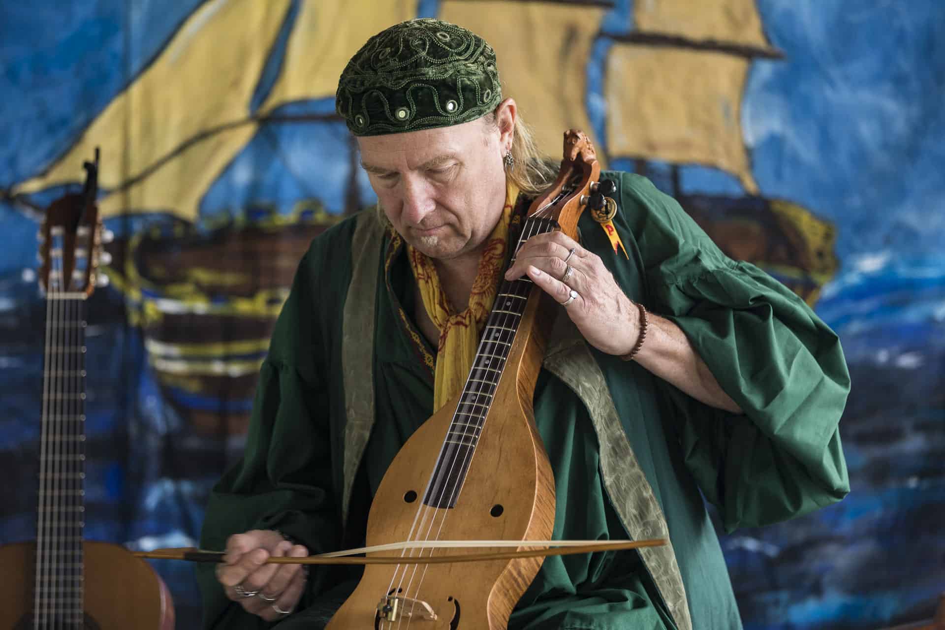 man playing stringed instrument